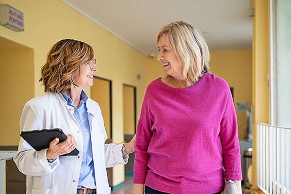 physician and patient walking