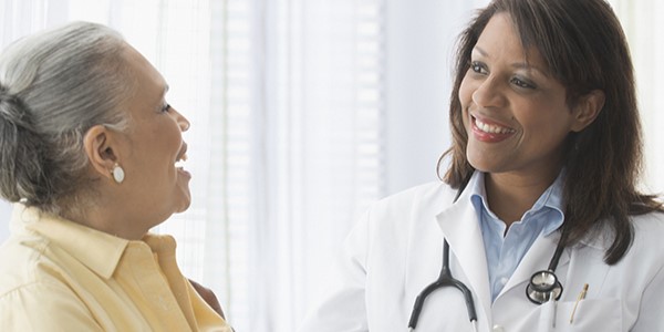 physician and woman speaking