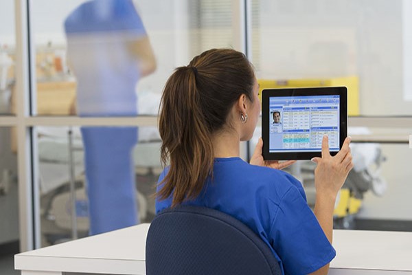 Nurse looking at tablet