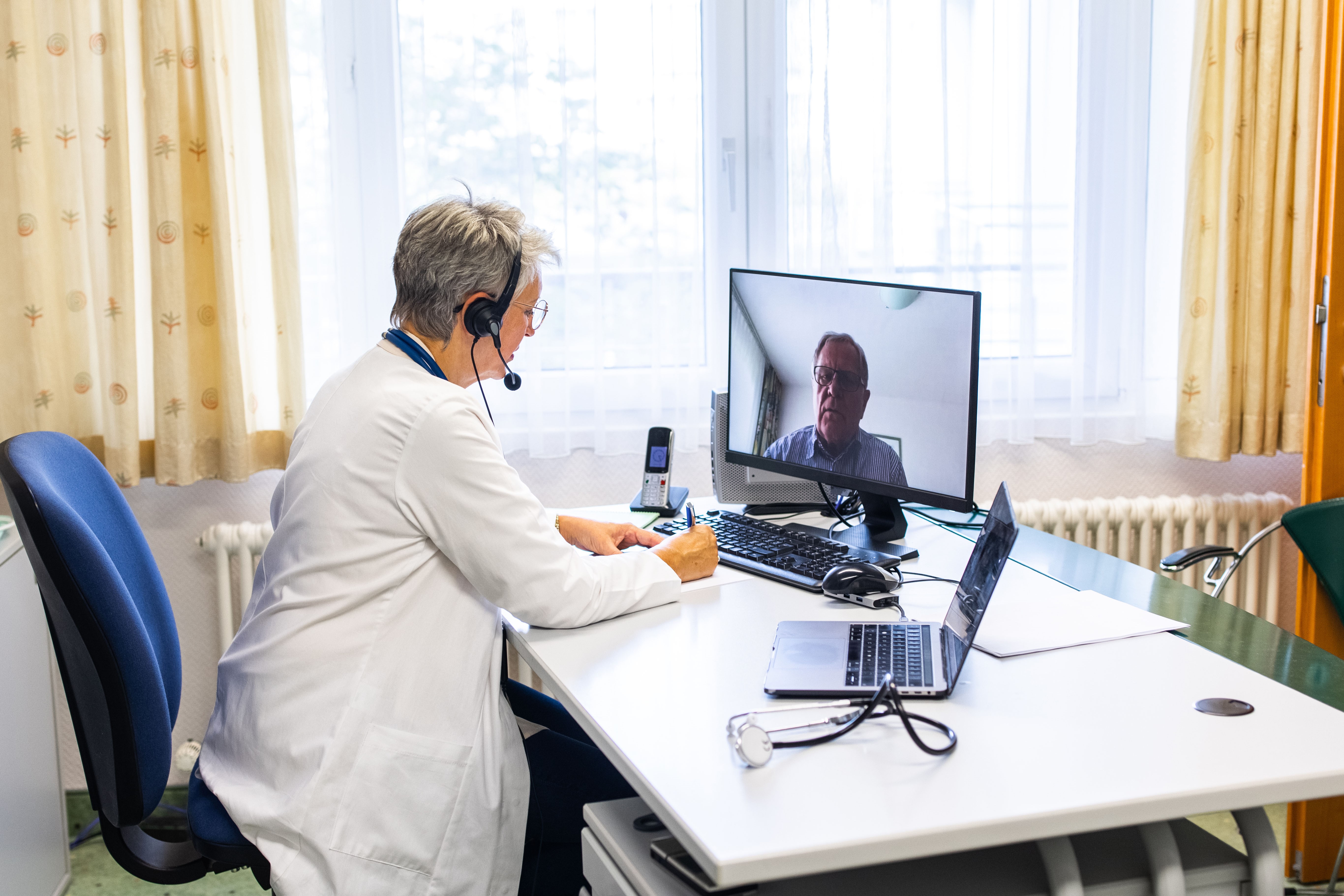 physician watching a webinar
